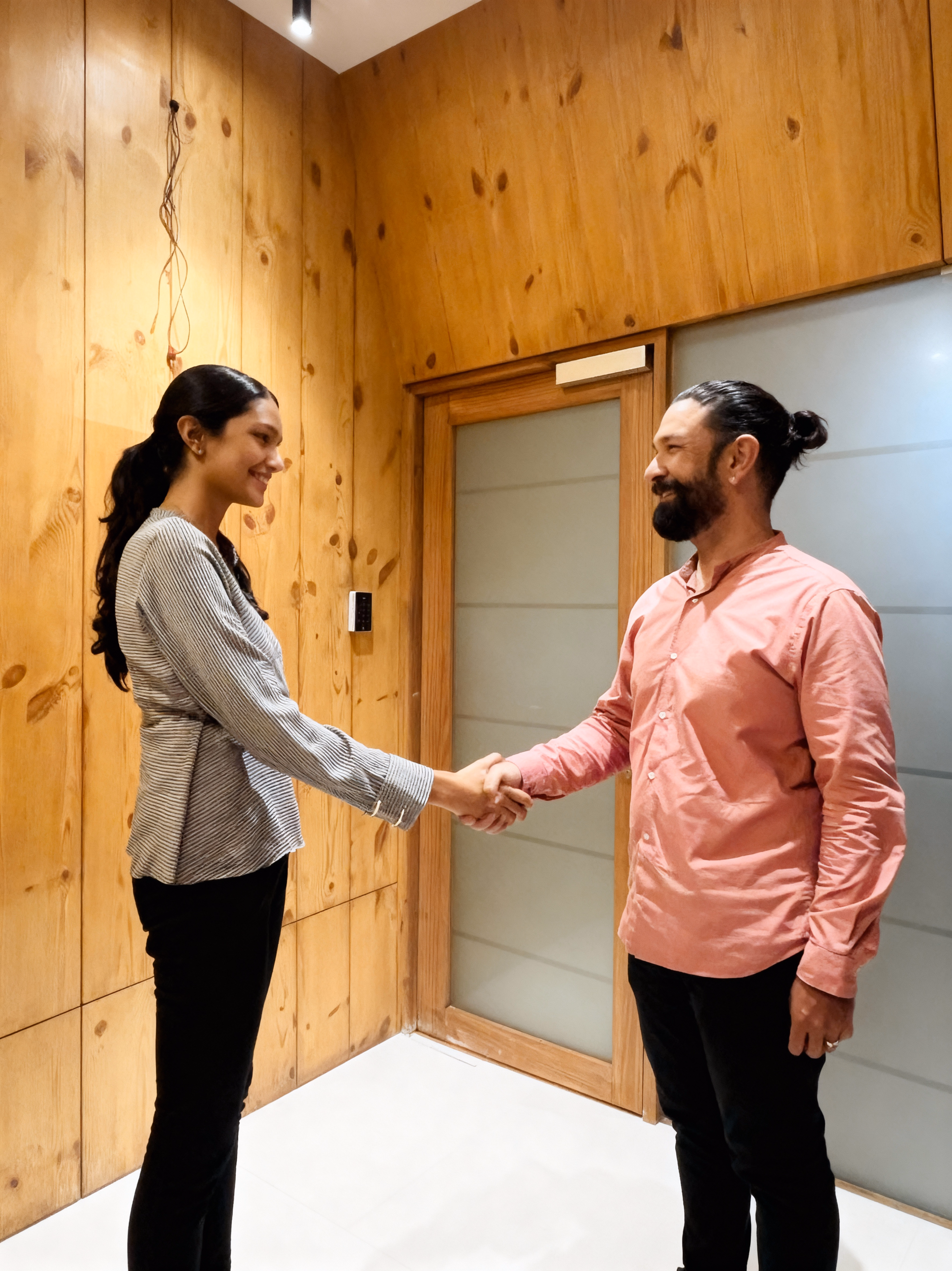 Dark wood console table with tall blue vases